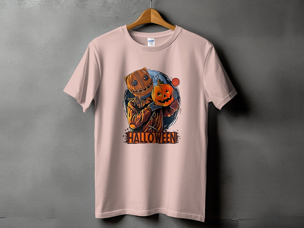 T-shirt with Halloween graphic of a scarecrow holding a pumpkin and lollipop.