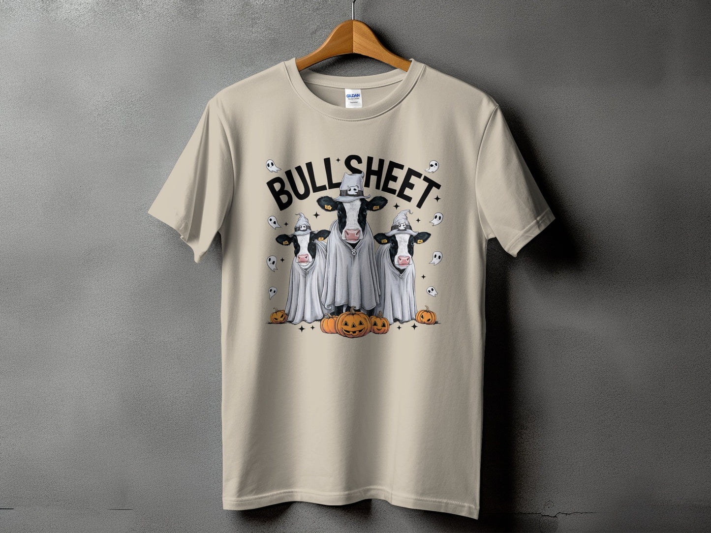 T-shirt with three cows in ghost costumes and pumpkins, "Bull's Sheet" text.
