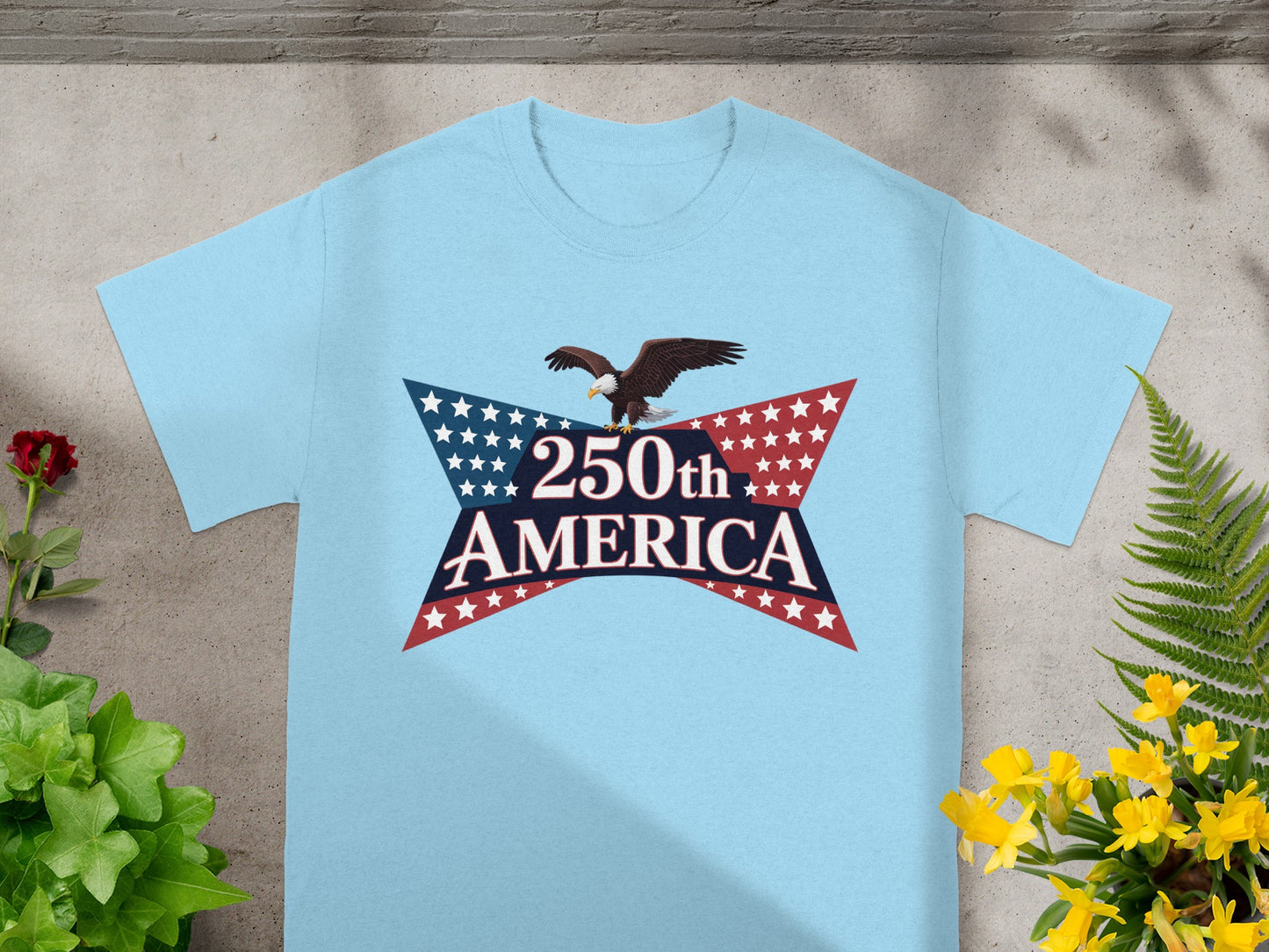 Light blue t-shirt with "250th AMERICA" starburst logo and eagle.