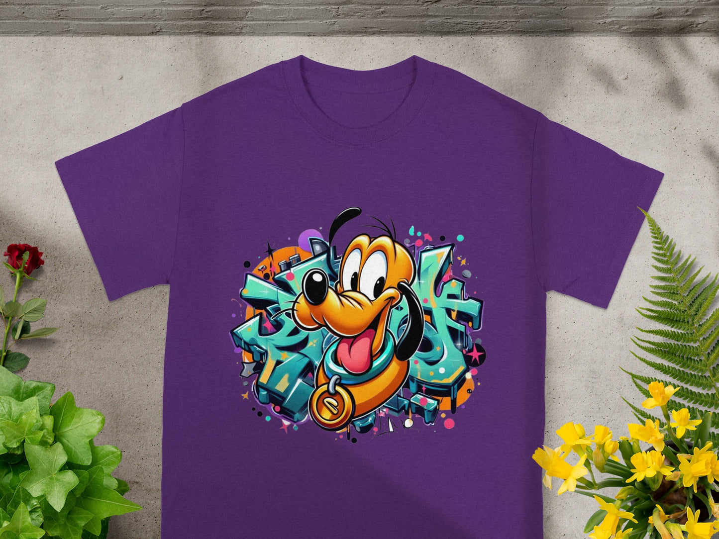 Purple t-shirt featuring cartoon dog Pluto with graffiti background.