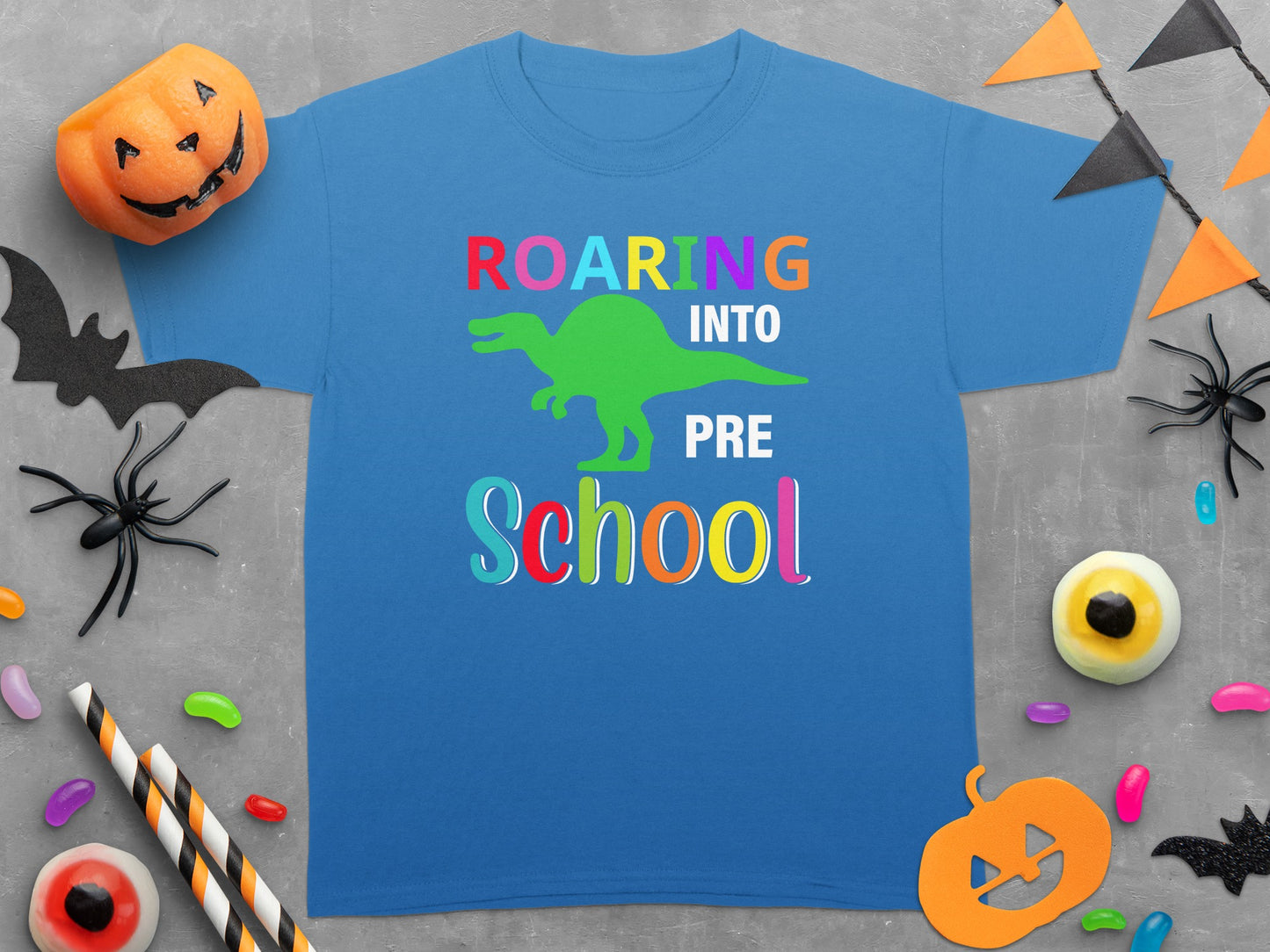 Blue t-shirt with dinosaur graphic and "Roaring Into Pre School" text.