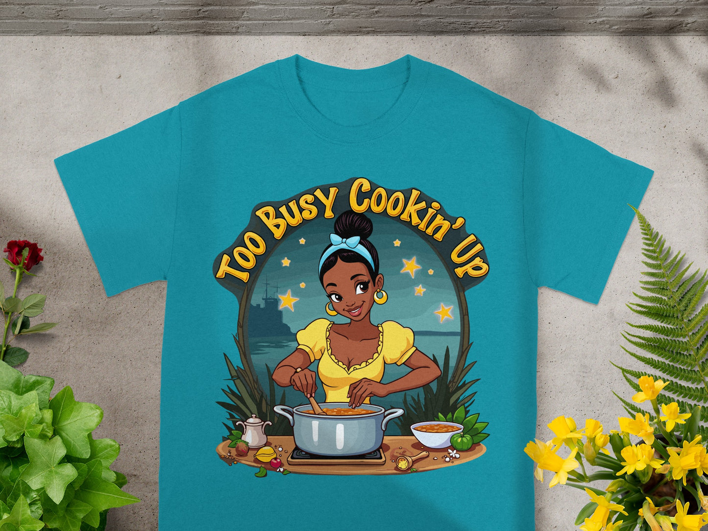 Woman in yellow shirt cooking with stars and text "Too Busy Cookin' Up".