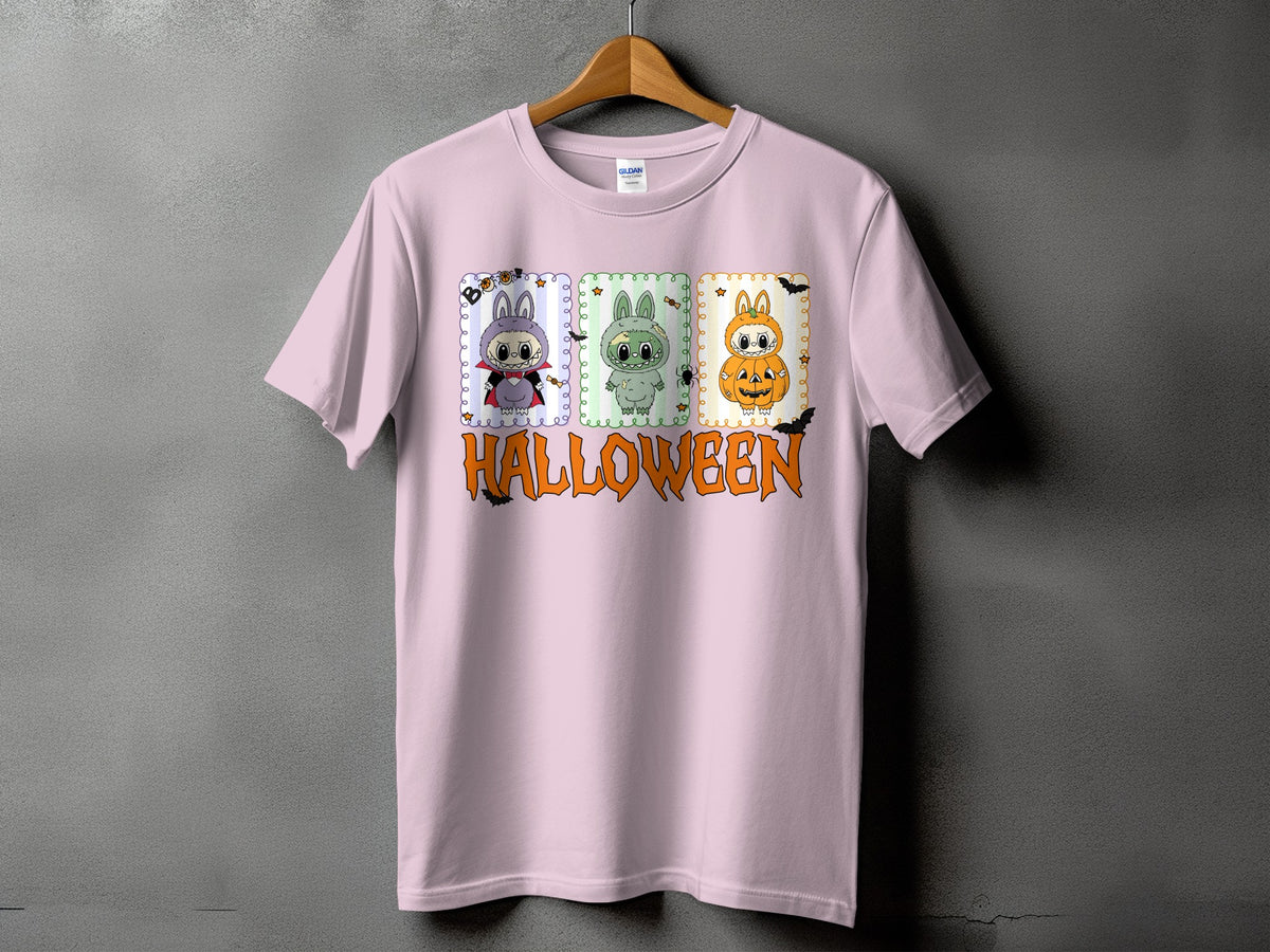 Pink t-shirt with three Halloween-themed cartoon characters and the word "HALLOWEEN."