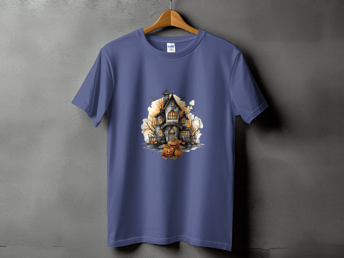 Purple t-shirt with a watercolor-style Halloween haunted house and pumpkins graphic.