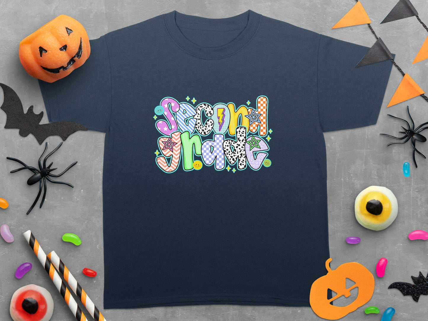 Navy t-shirt with a "Second Grade" graphic in colorful, patterned letters.