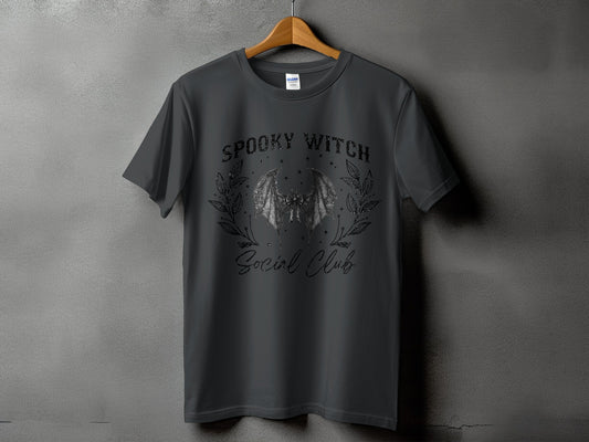 Dark grey t-shirt with "Spooky Witch Social Club" text and bat graphic.