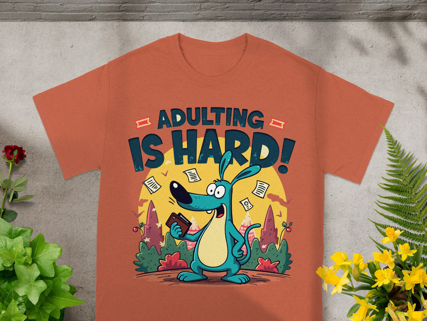 T-shirt with cartoon dog and text "ADULTING IS HARD!"