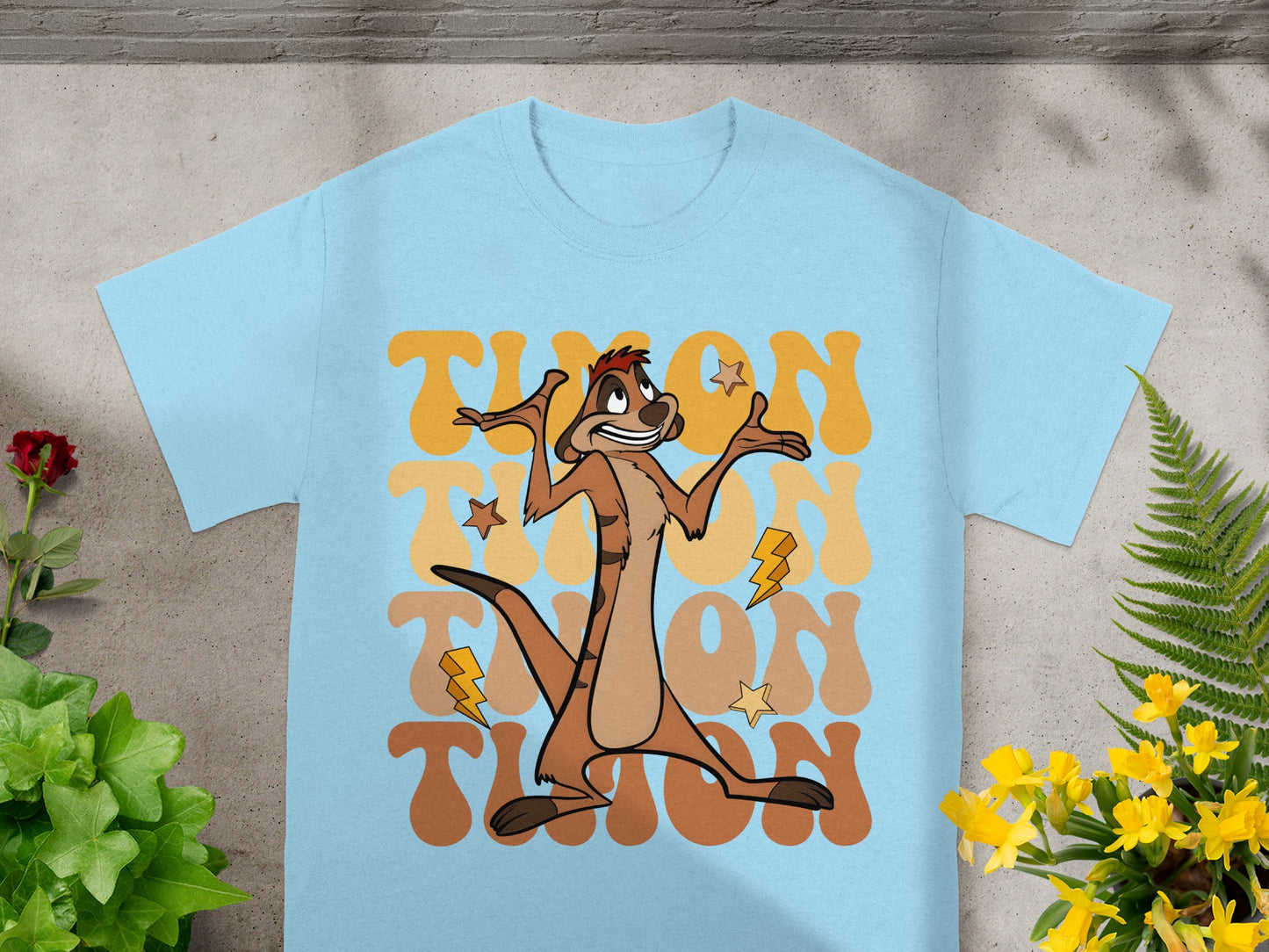 Light blue t-shirt featuring Timon from The Lion King with lightning bolt graphic.