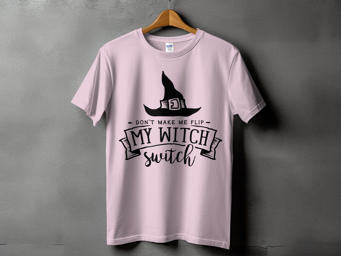 Pink t-shirt with a black witch hat and the text "Don't Make Me Flip My Witch Switch".
