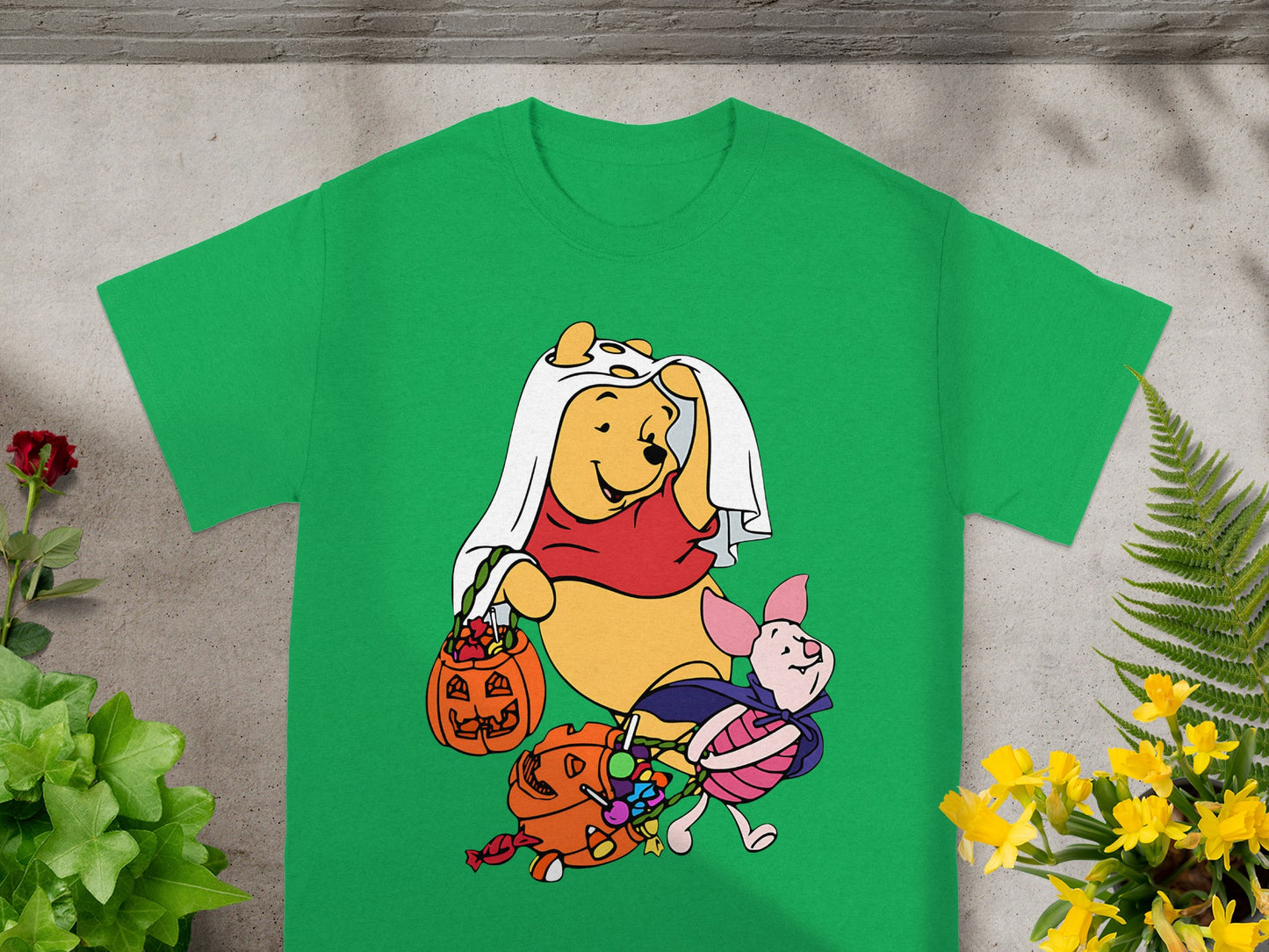 Winnie the Pooh and Piglet in Halloween costumes with candy.