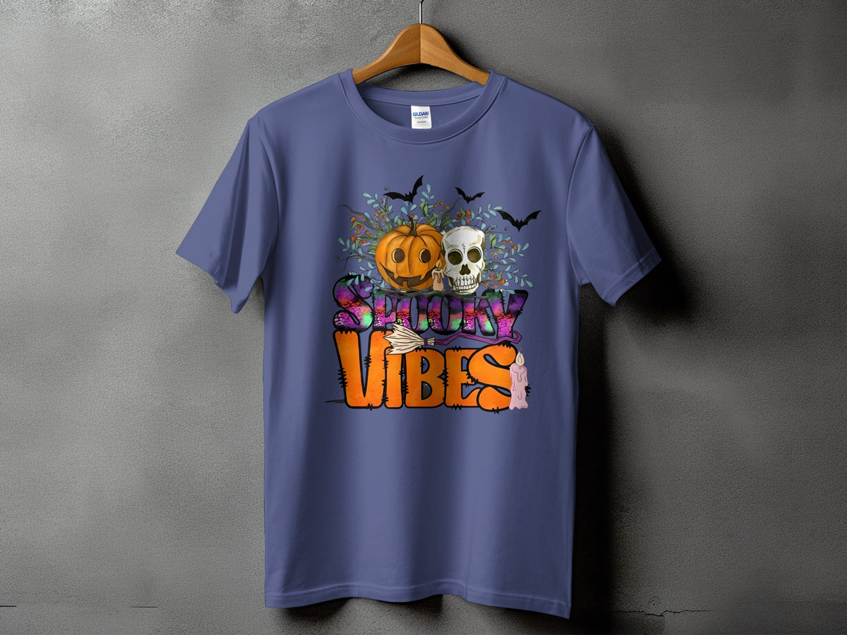 Purple t-shirt with "Spooky Vibes" text featuring a pumpkin, skull, bats, and candle.