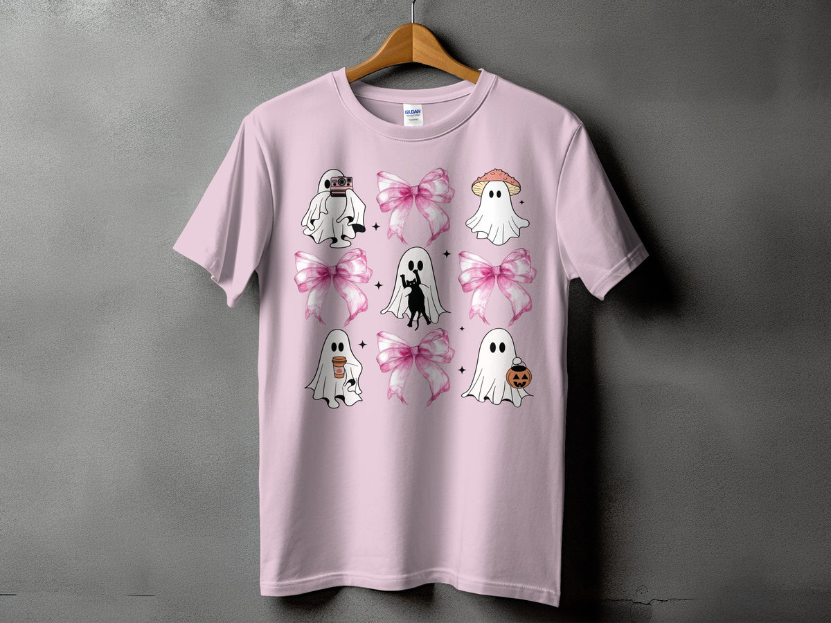 Pink t-shirt with Halloween-themed ghost graphics and pink bows.