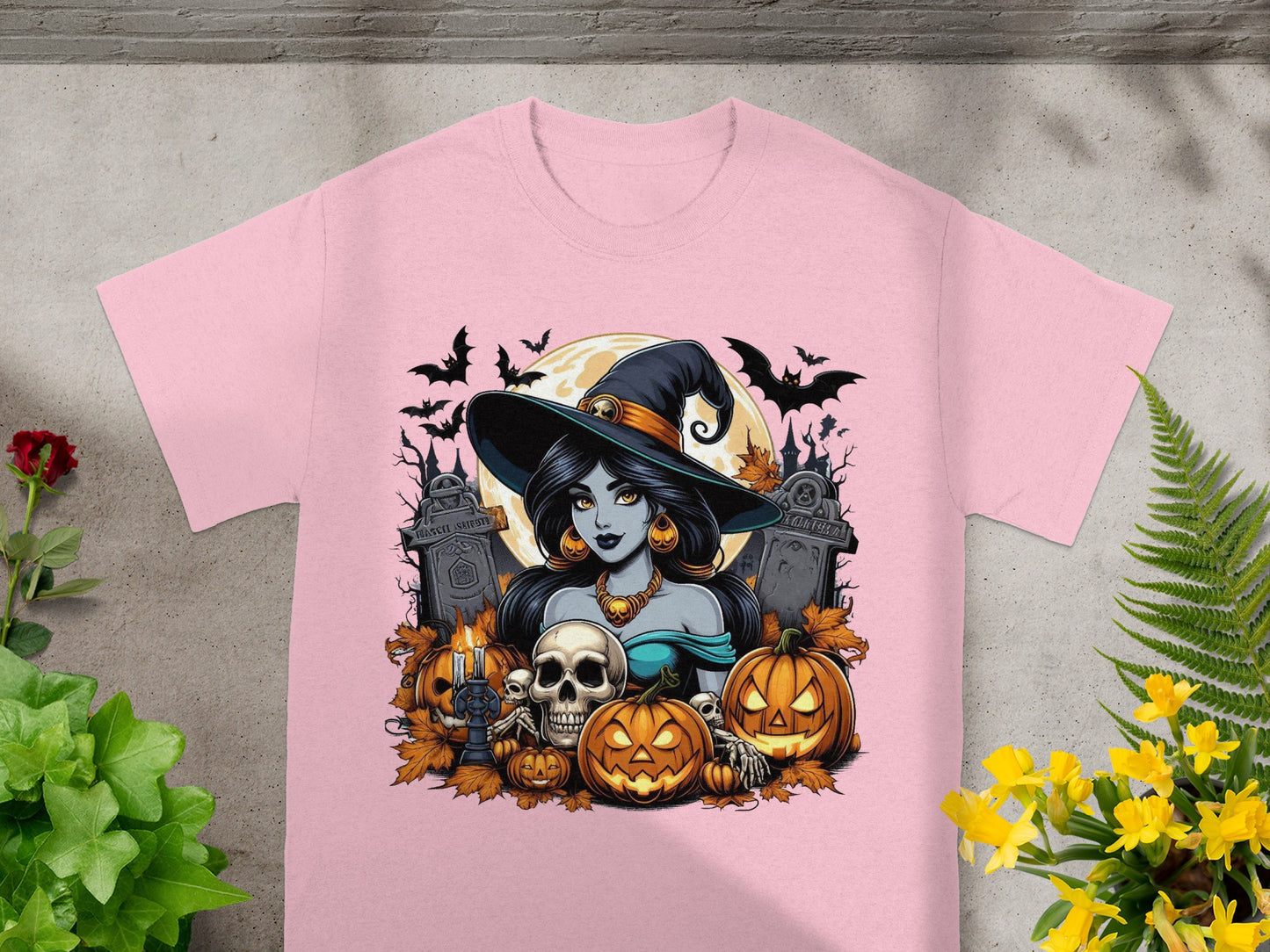 Halloween t-shirt with witch, pumpkins, skull, bats, and tombstones.