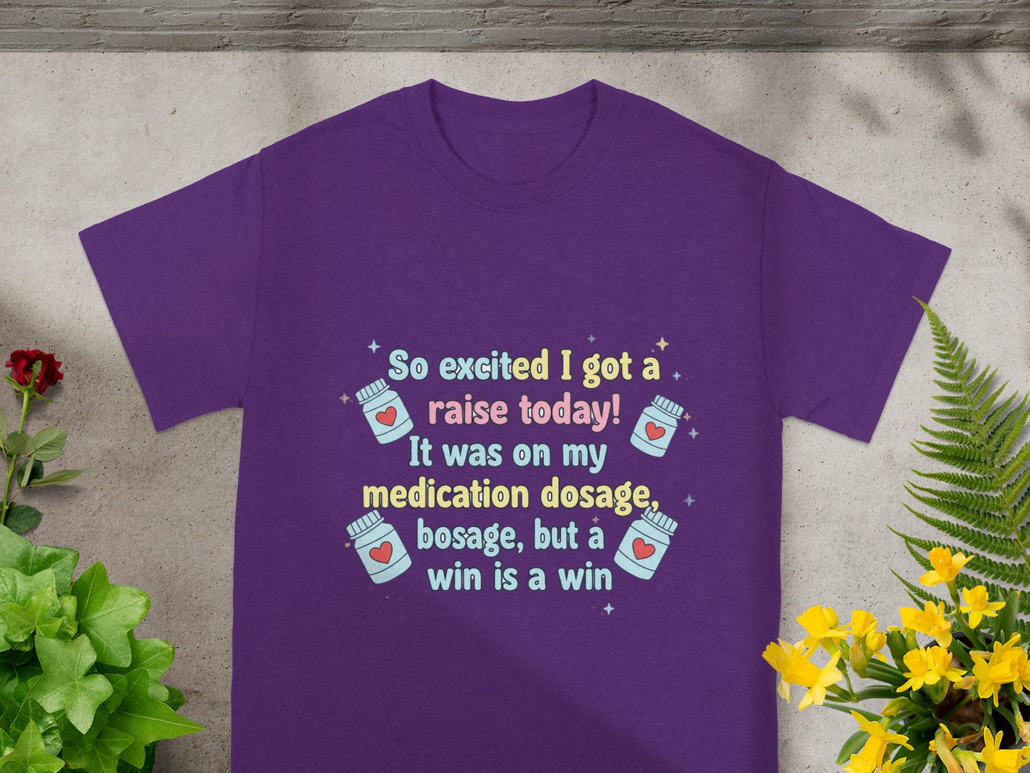 Purple t-shirt with text about medication dosage and a raise.
