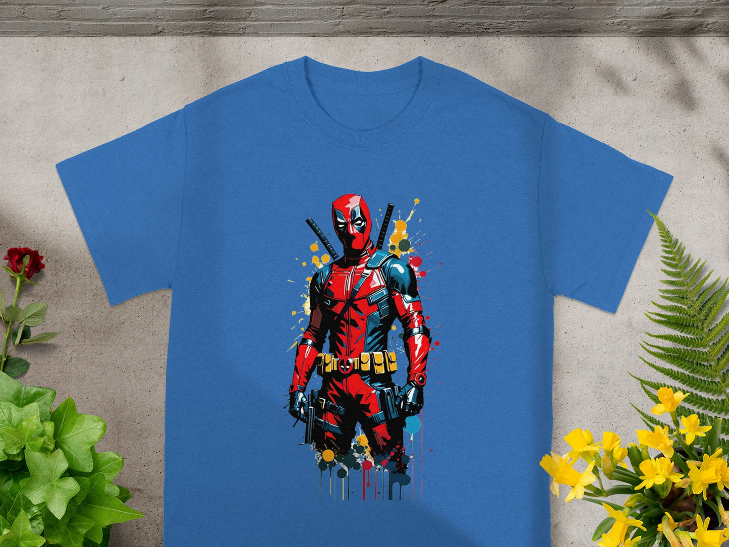 Blue t-shirt featuring a distressed illustration of Deadpool in battle pose.