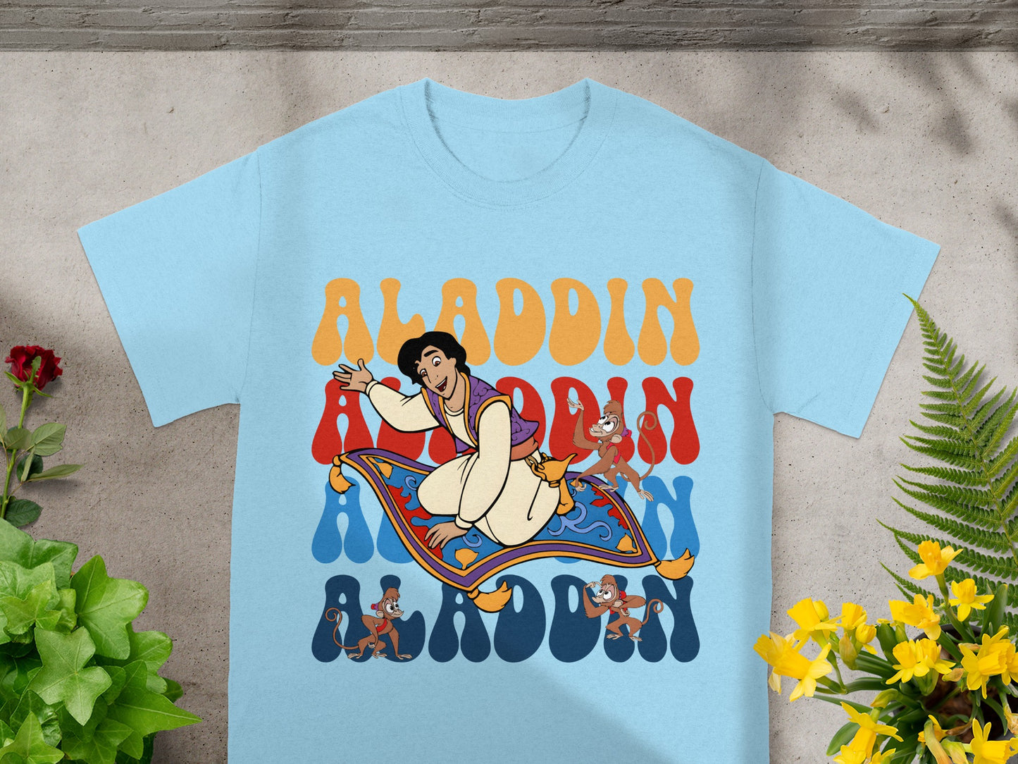 Aladdin and Abu flying on a magic carpet with stylized text.