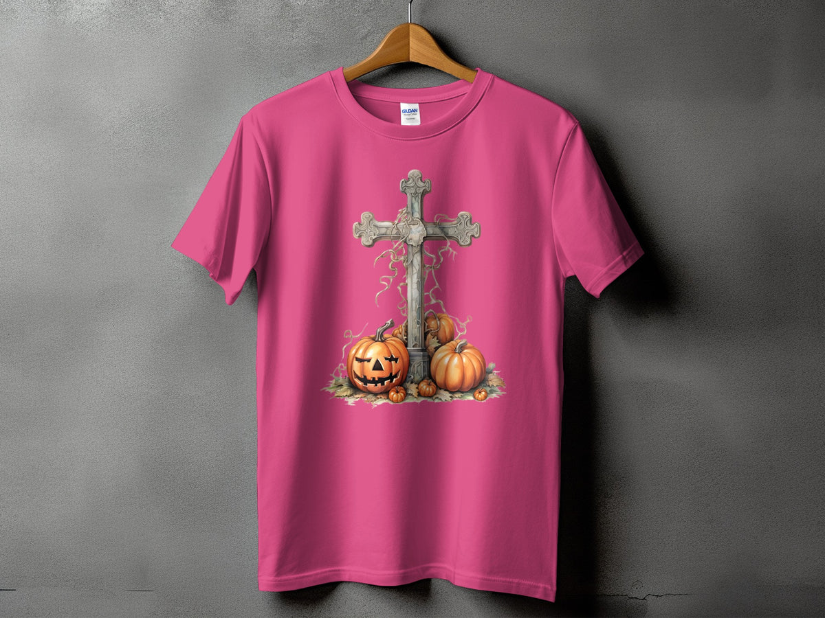 Pink t-shirt with graphic of cross and pumpkins.