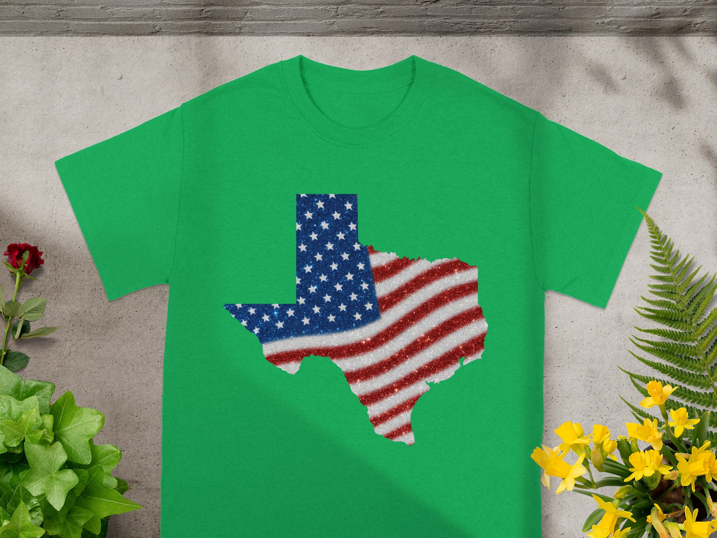 Green t-shirt with Texas map outline filled with American flag stars and stripes glitter.