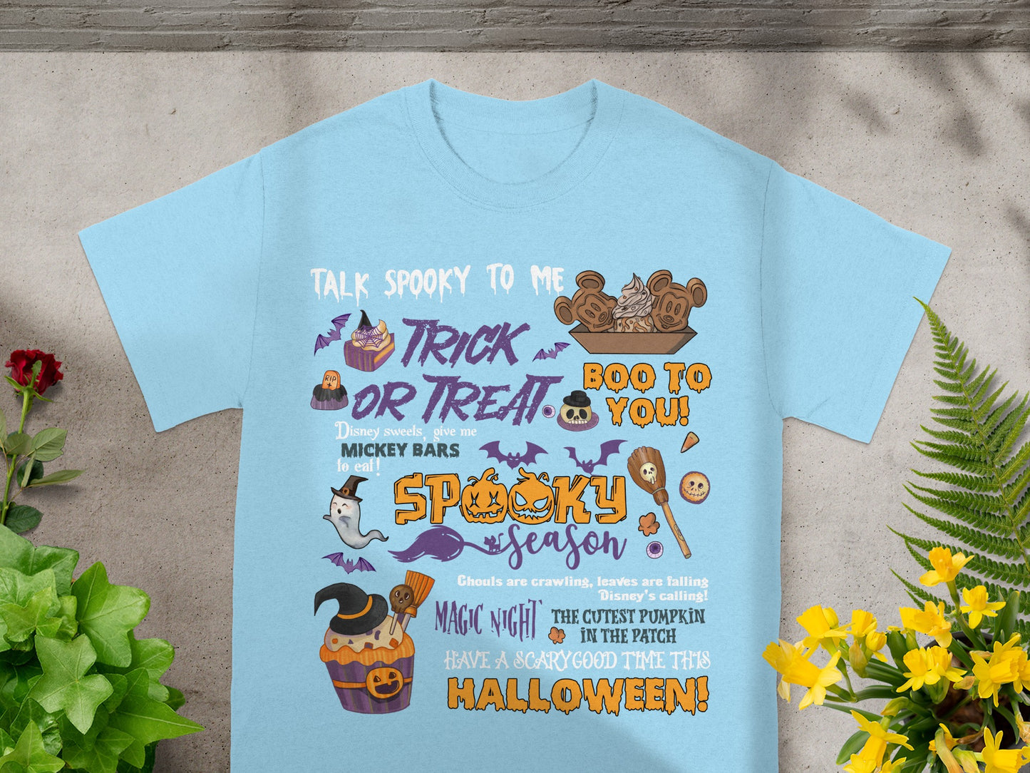 Light blue t-shirt with Halloween-themed graphics and text: "Talk Spooky to Me Trick or Treat Boo to You".