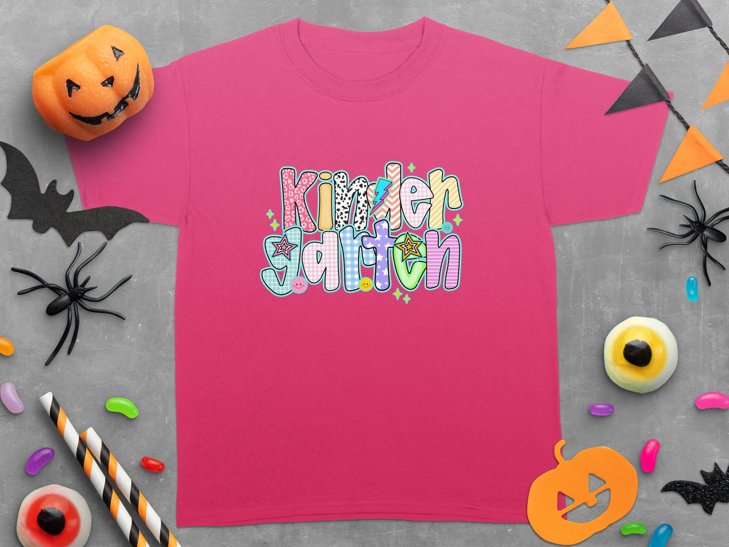 Pink t-shirt with "Kinder Garten" text in colorful, patterned letters.