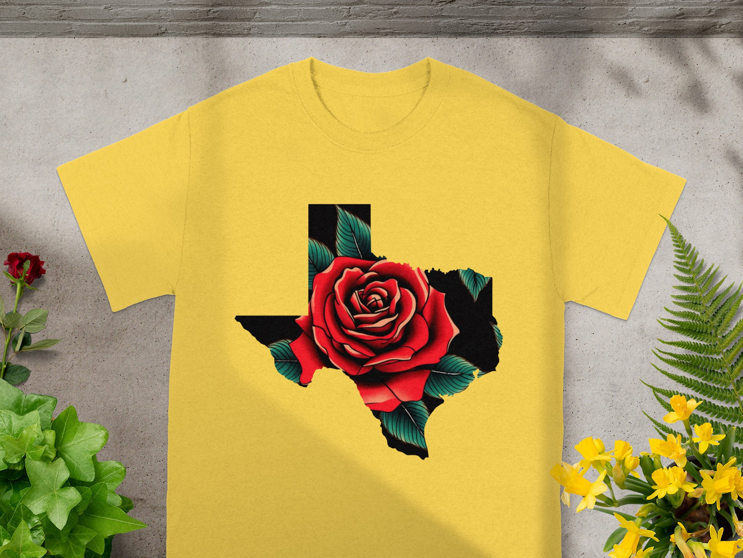 Yellow t-shirt featuring a red rose inside the shape of Texas.