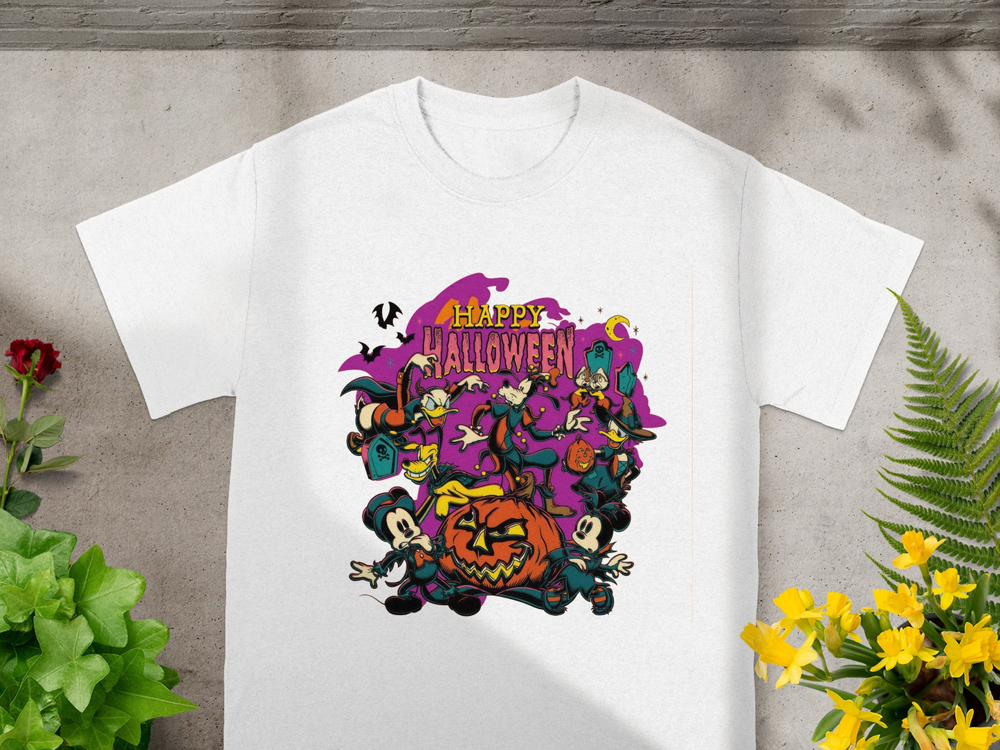 White t-shirt with "Happy Halloween" graphic featuring Mickey, Minnie, and friends around a pumpkin.
