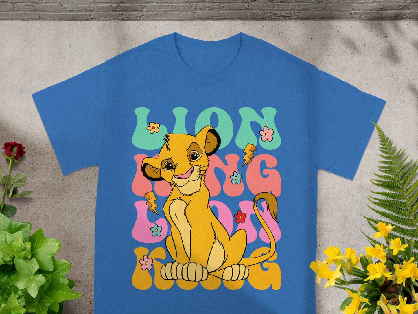 Blue t-shirt featuring Simba from The Lion King with "LION KING" text.