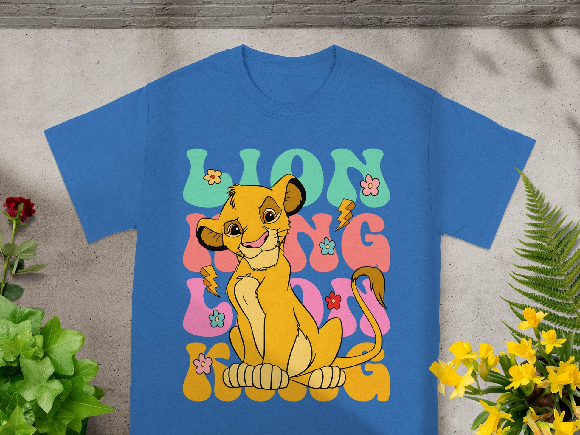 Blue t-shirt featuring Simba from The Lion King with "LION KING" text.