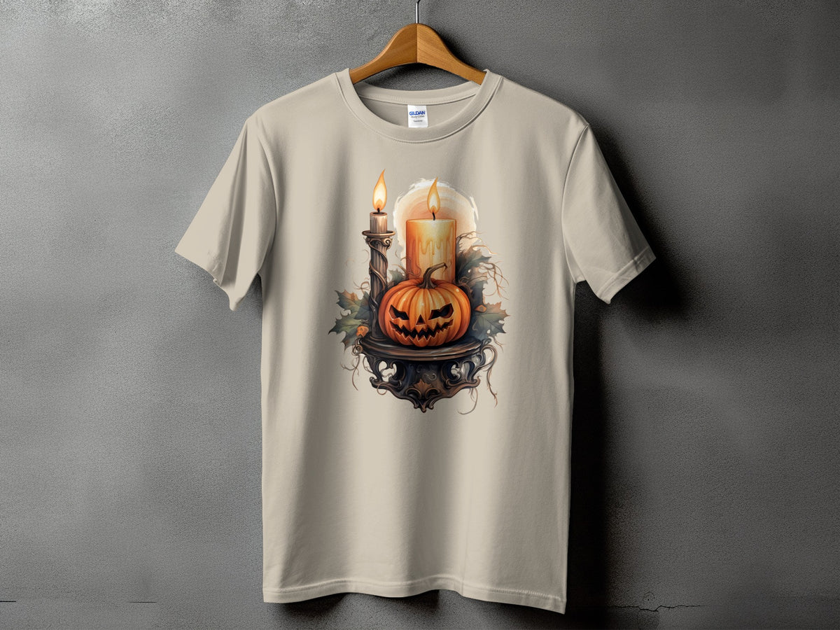 Light beige t-shirt with Halloween pumpkin, lit candles, and foliage graphic.