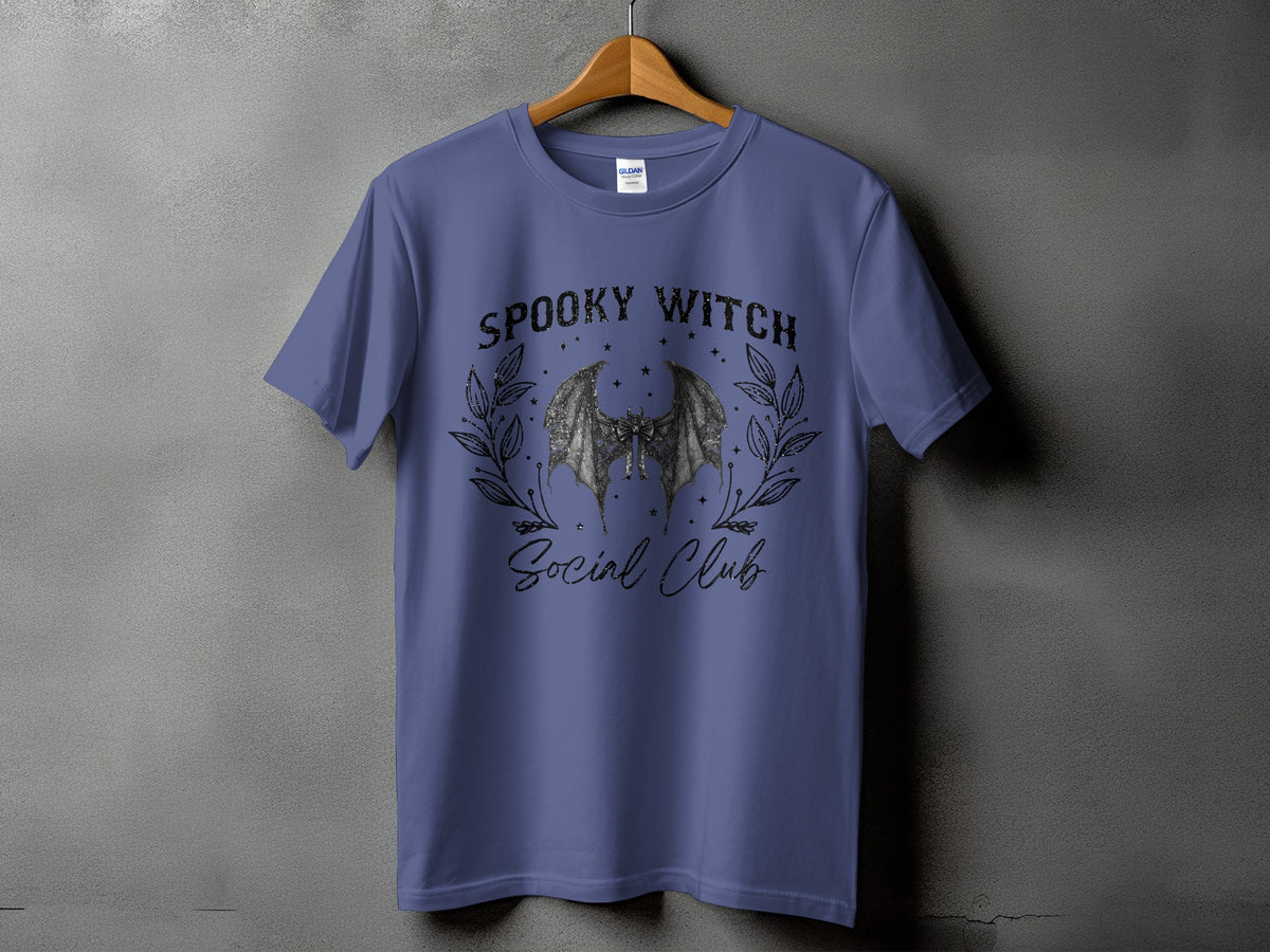 Purple t-shirt with a "Spooky Witch Social Club" graphic featuring bat wings.