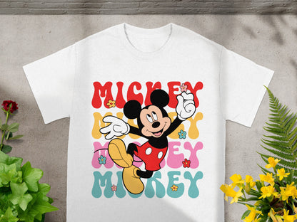 Mickey Mouse graphic with "Mickey" text and floral details on a white t-shirt.