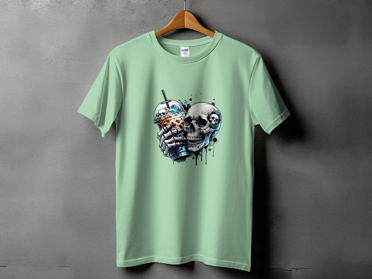 Mint green t-shirt with a graphic of a skull holding a bubble tea and another skull.