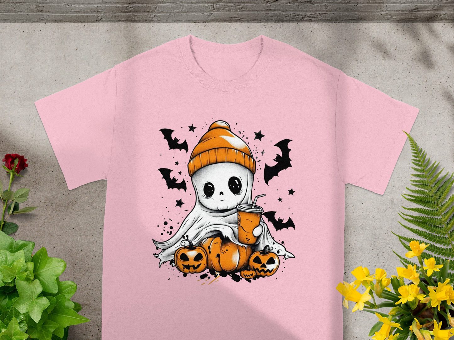 Cute ghost in beanie with drink, surrounded by pumpkins and bats.