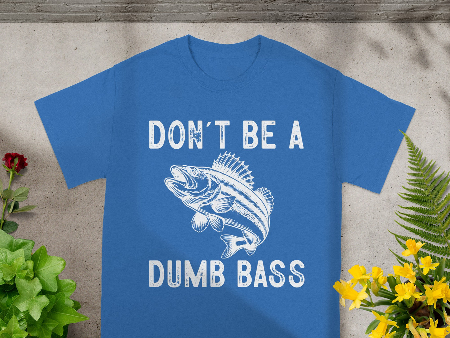 Blue t-shirt with white text and fish graphic reading "DON'T BE A DUMB BASS."