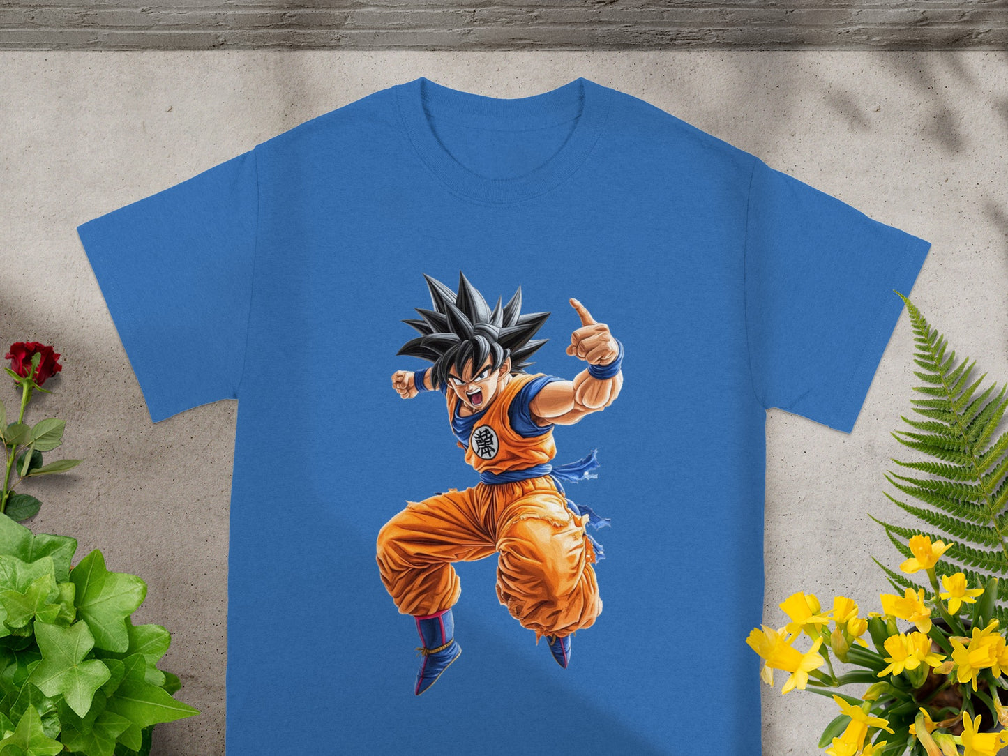 Goku in orange gi, jumping and pointing with a thumbs-up.