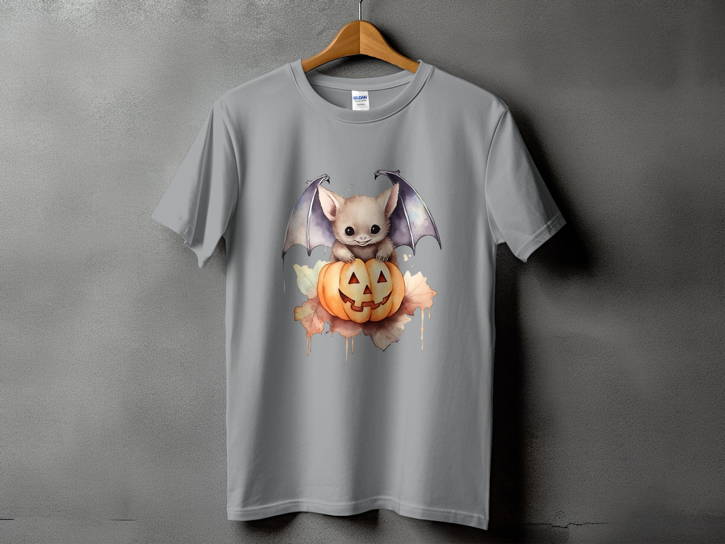 Cute bat with wings sits on a Halloween pumpkin with watercolor splashes.