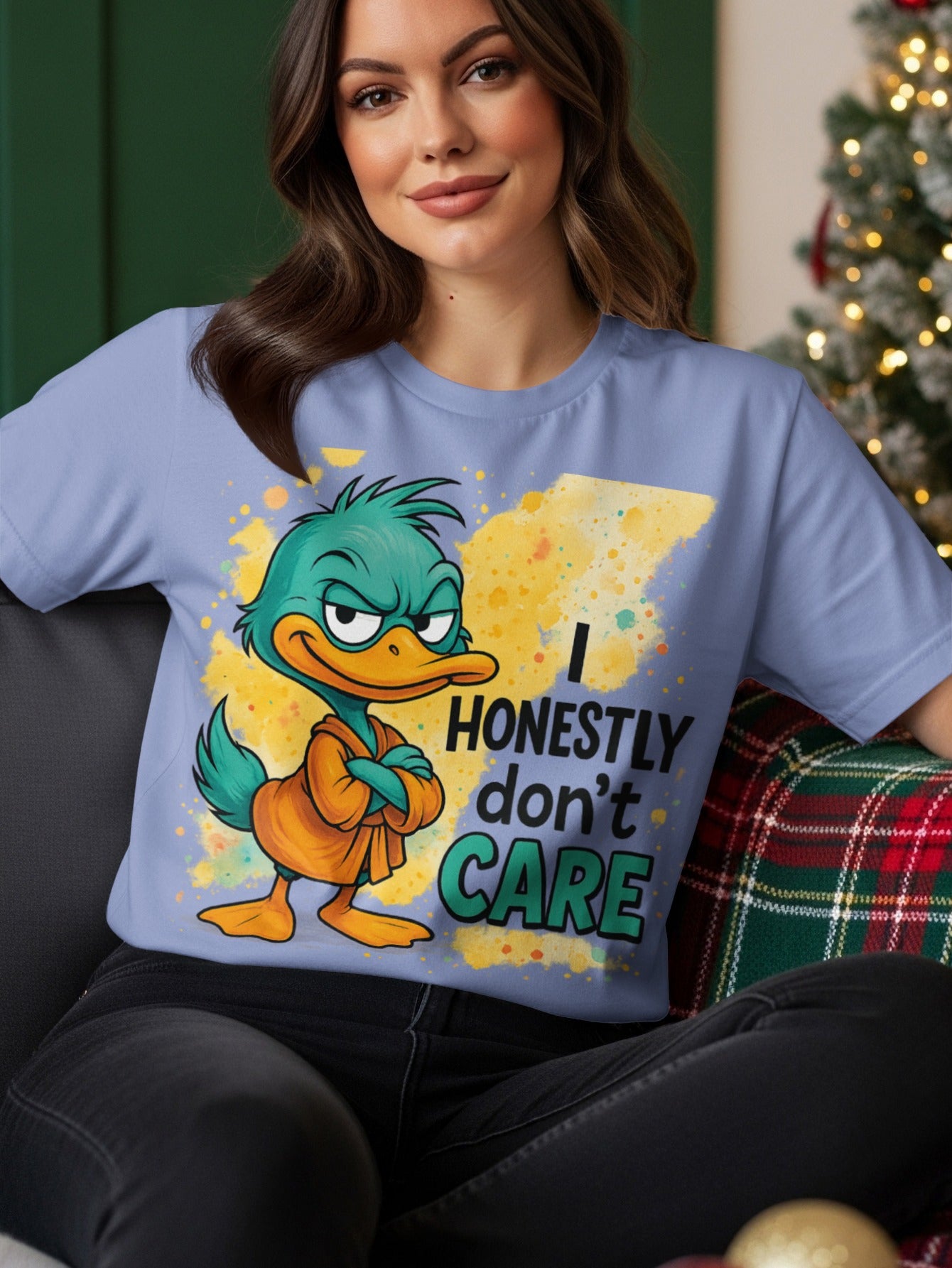 Cartoon duck wearing an orange robe on a light purple t-shirt that says "I HONESTLY DON'T CARE".