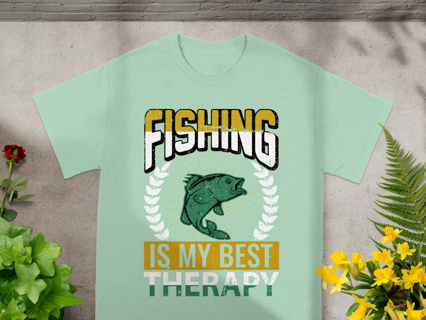 Mint green t-shirt with "FISHING IS MY BEST THERAPY" and a fish graphic.