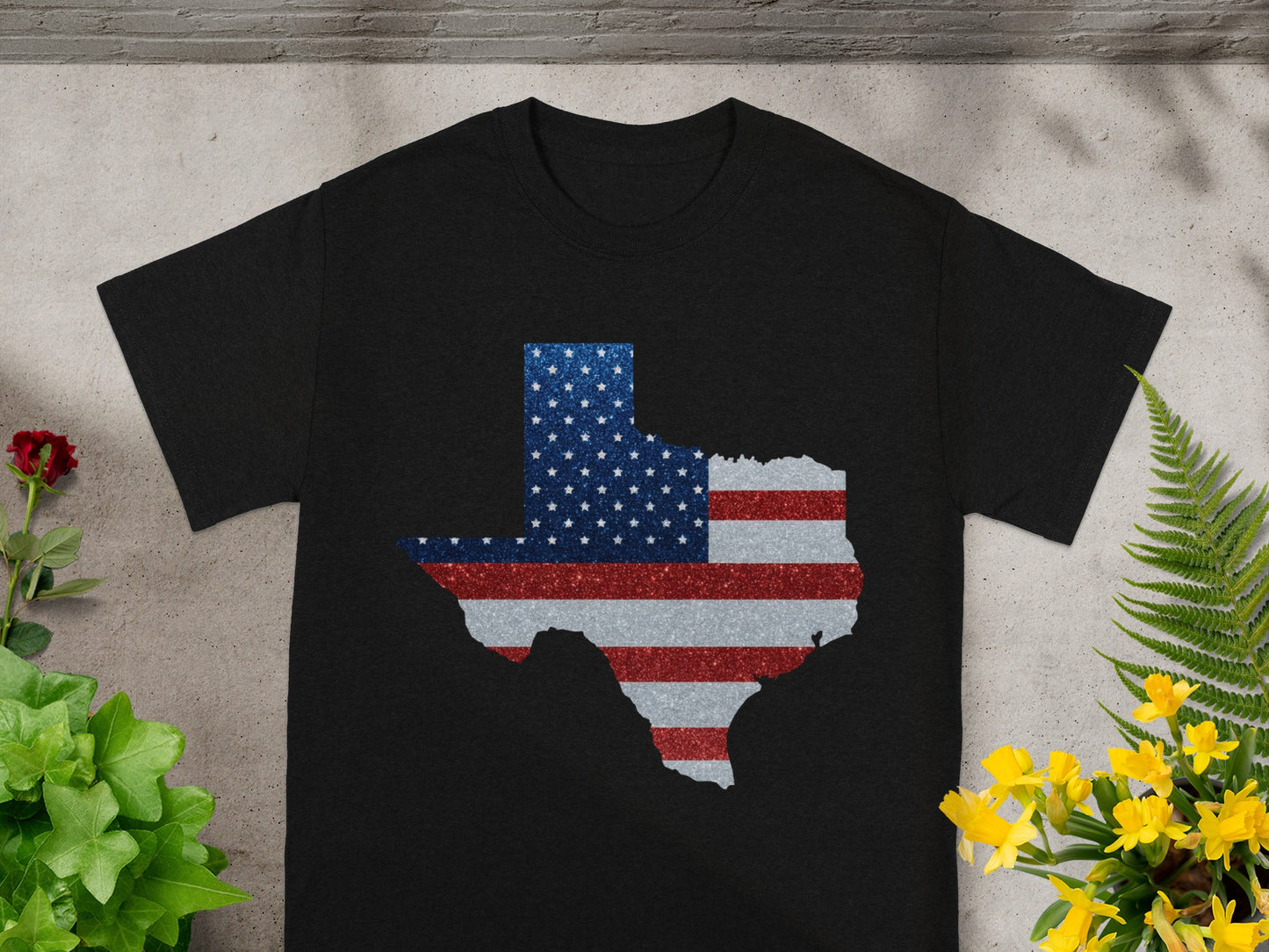 Black t-shirt with a Texas shape filled with the American flag design.