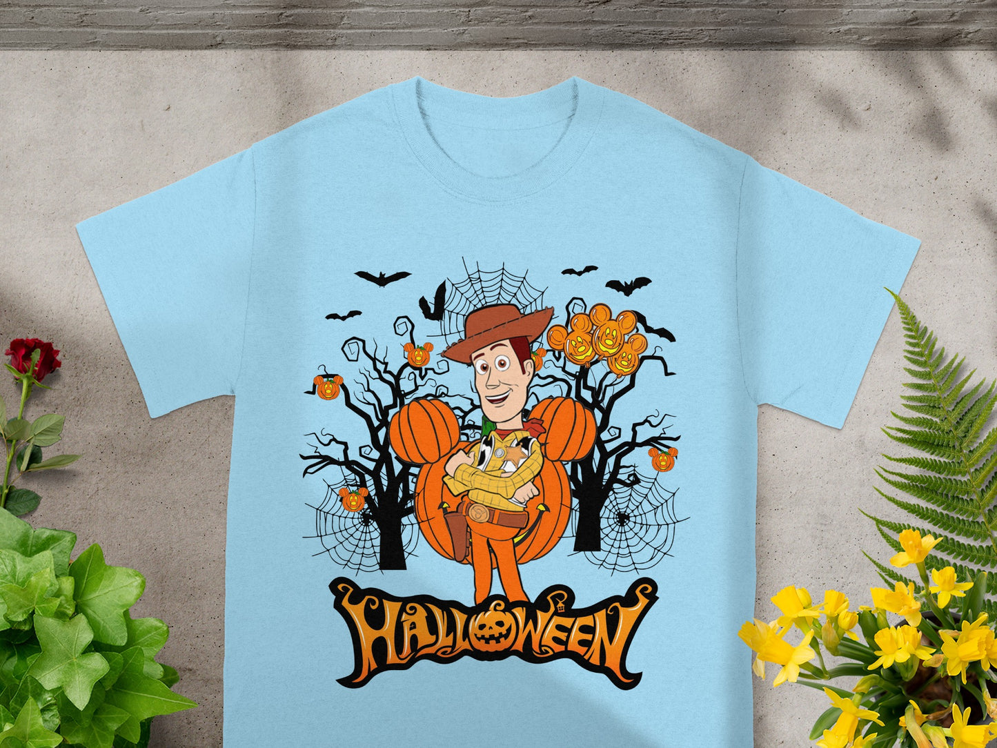 Light blue t-shirt with Woody character and "Halloween" text design.