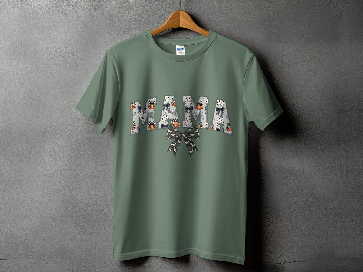 Green t-shirt with "MAMA" text in a Halloween-themed font.