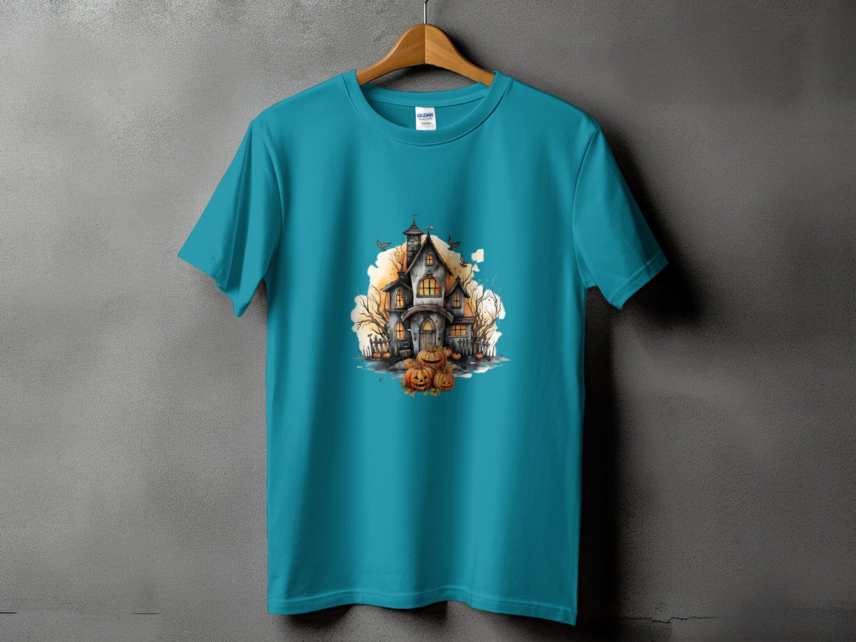 Teal t-shirt with a Halloween haunted house and pumpkins graphic.