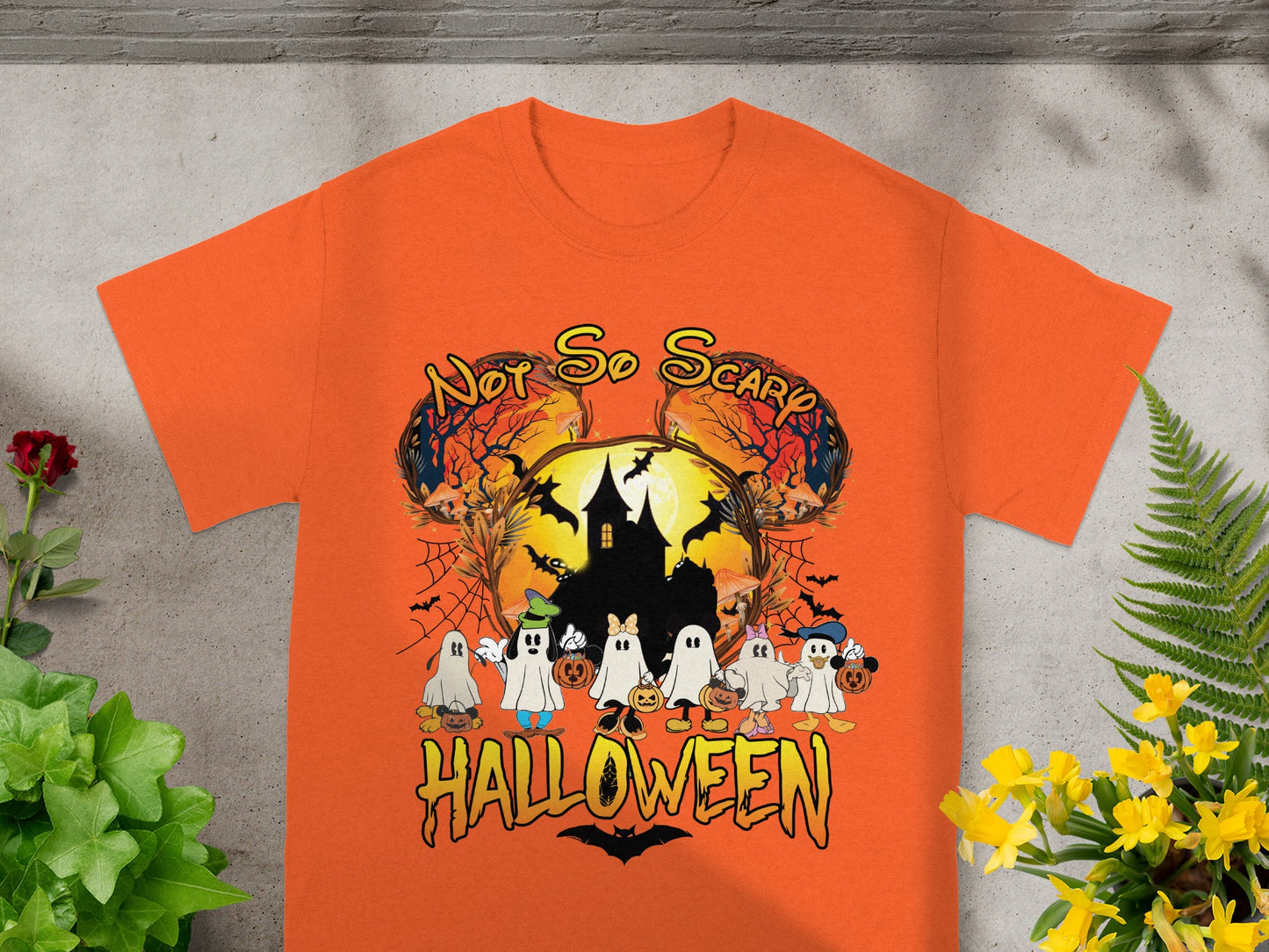 Orange t-shirt with "Not So Scary Halloween" text and cartoon ghosts.