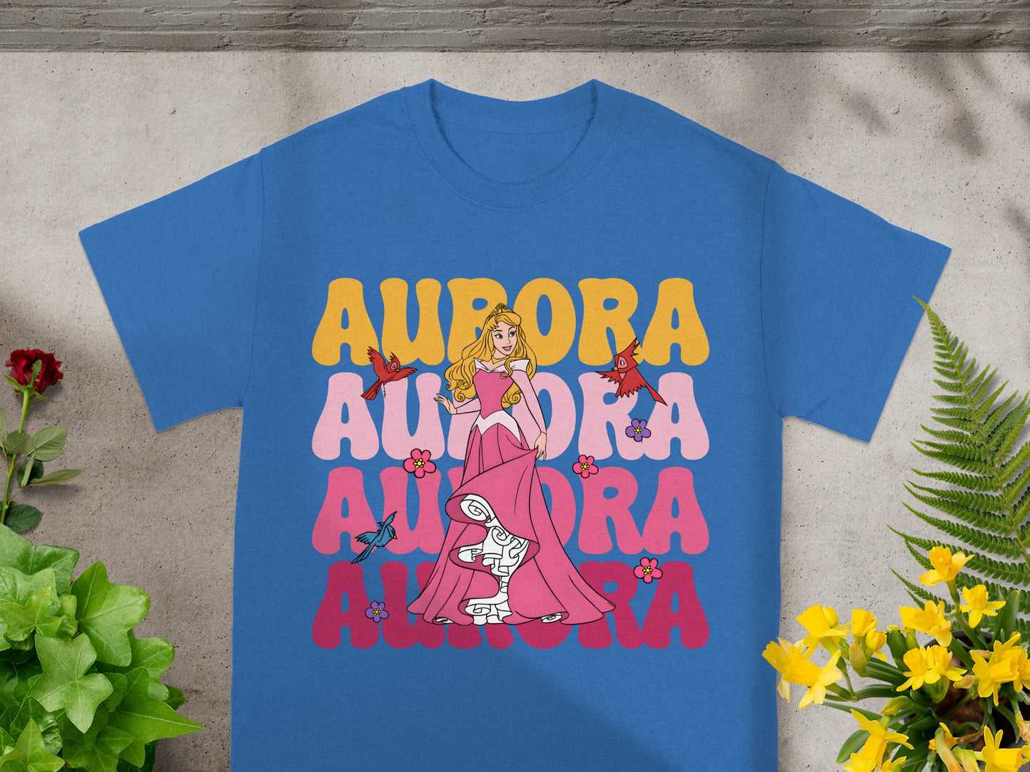 Blue t-shirt with Aurora from Sleeping Beauty and floral elements.