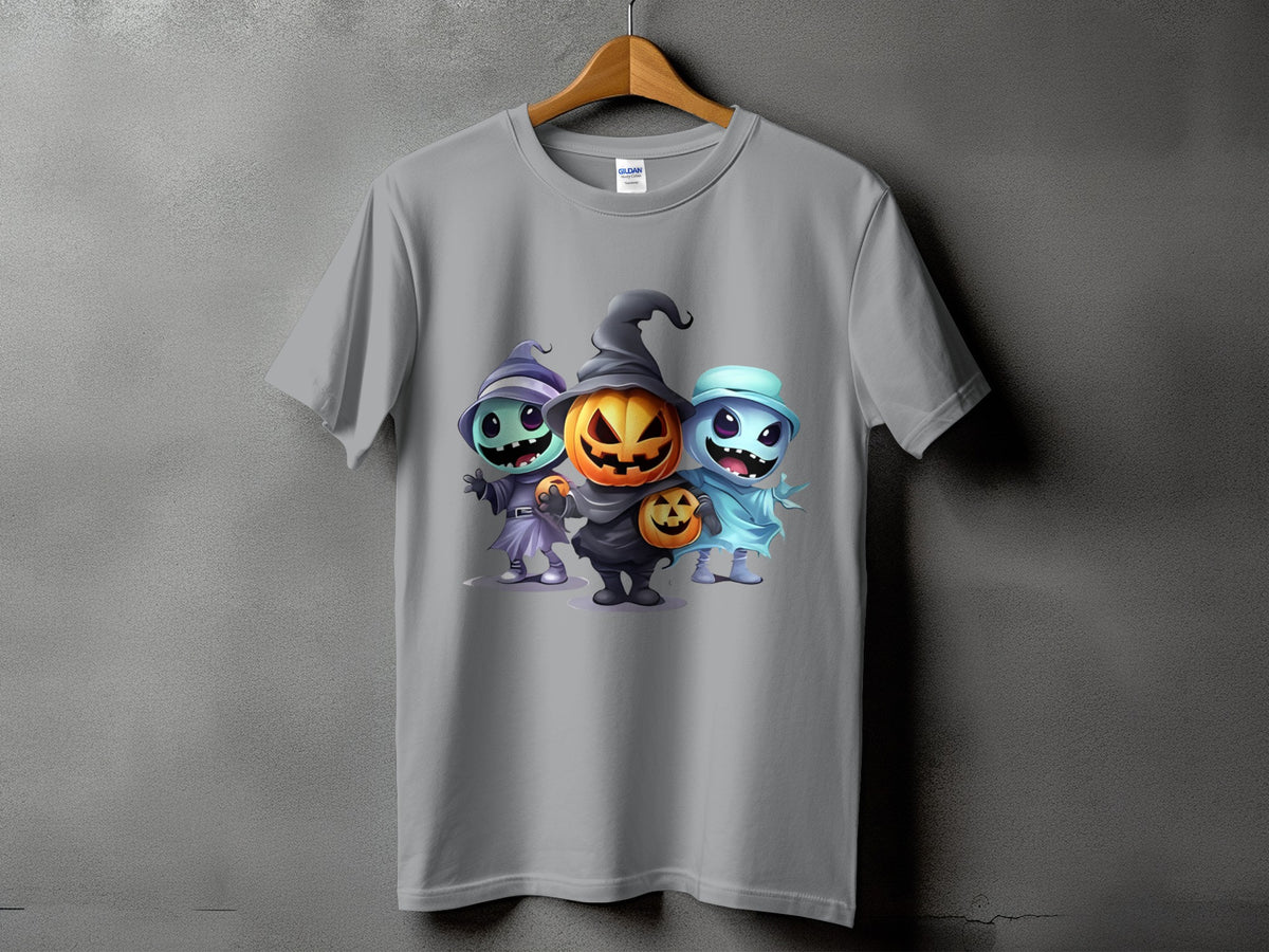 T-shirt with graphic of three cartoon Halloween monsters: pumpkin, ghost, and witch.