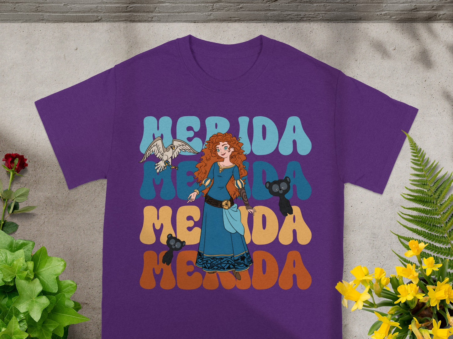 Merida from Brave on a purple t-shirt with "Merida" text.