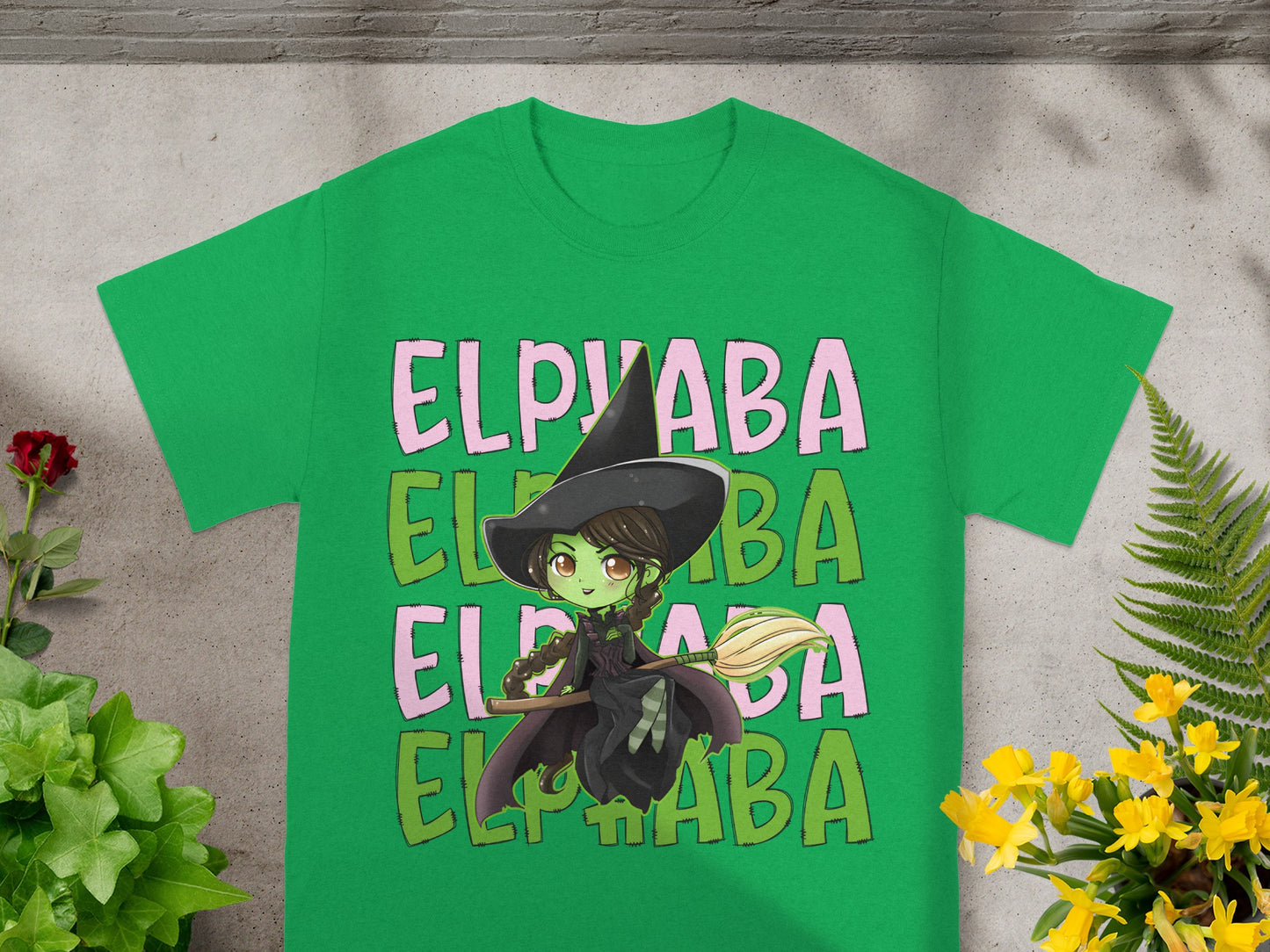 Green t-shirt with Elphaba the witch graphic and repeating "ELPHABA" text.