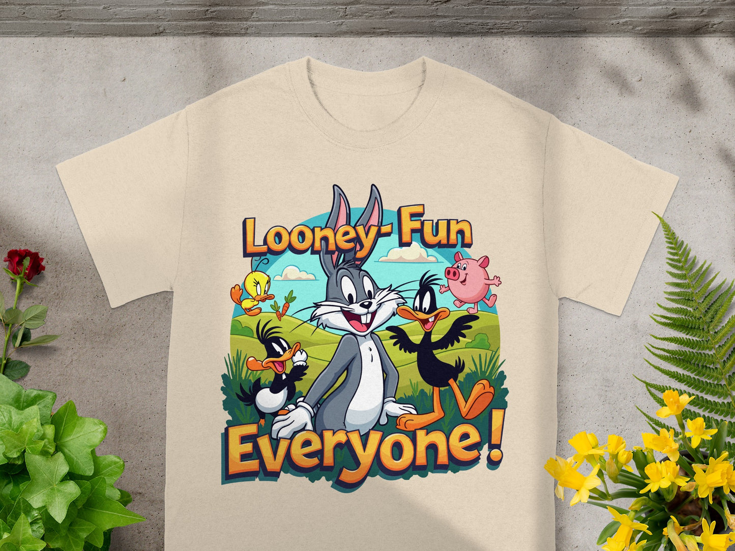 Looney Tunes characters Bugs Bunny, Daffy Duck, and Porky Pig on a tan t-shirt.