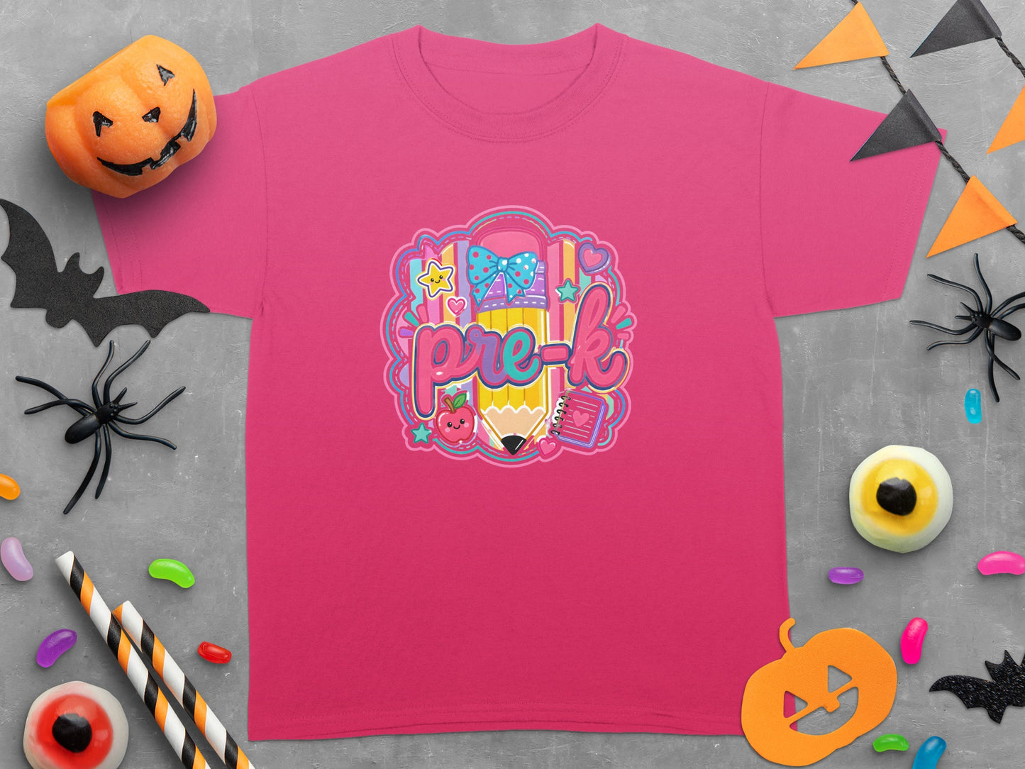 Pink t-shirt with "pre-k" lettering, a pencil, and school supplies graphic.
