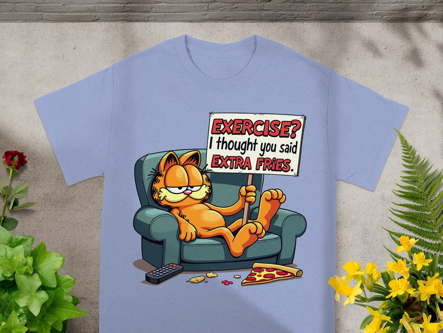 Garfield sitting on a couch with a sign that says "EXERCISE? I thought you said EXTRA FRIES."